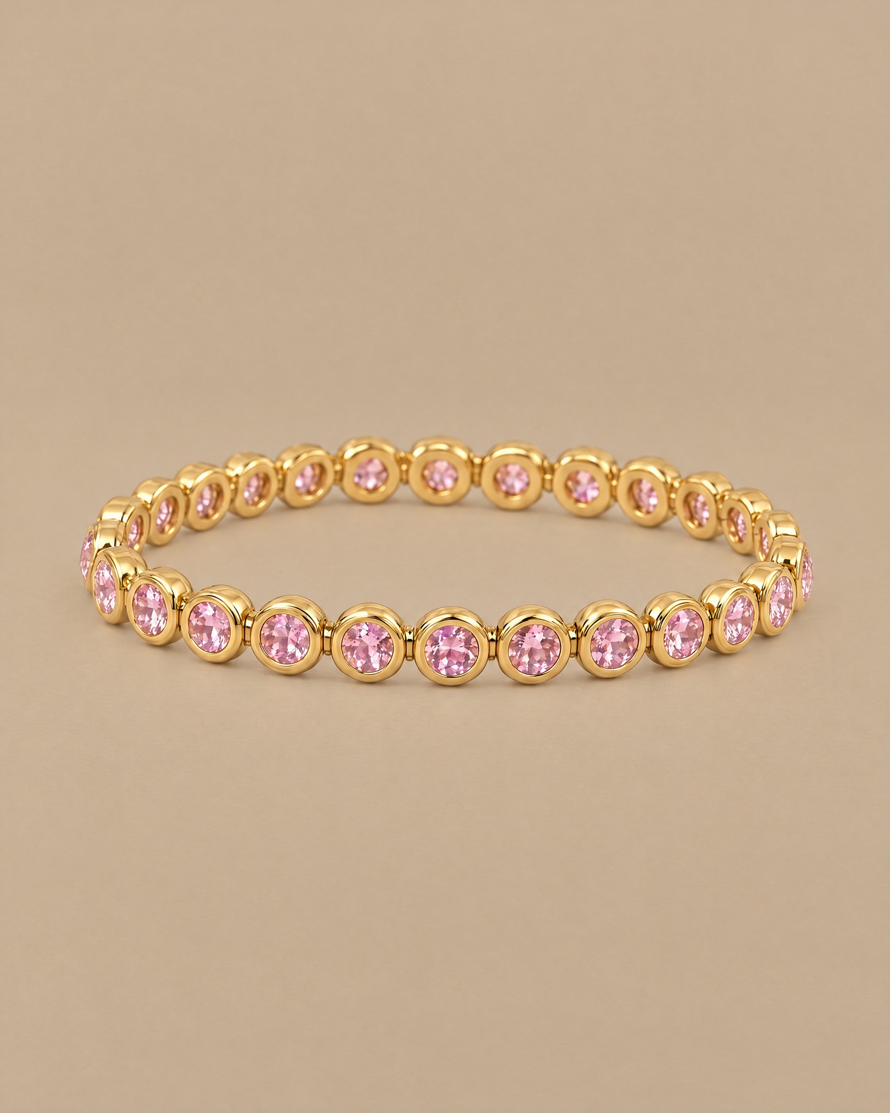 The pink round-stone bracelet in a still-life photograph